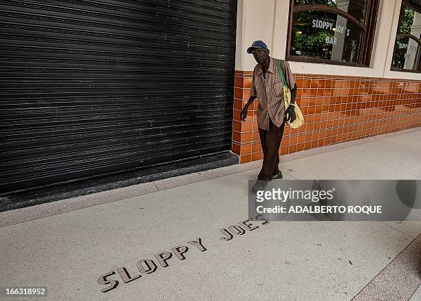 Man walks next to the newly renovated "Sloppy Joe's" bar in Havana, on April 11, 2013. "Sloppy" was one of the most famous places in the...