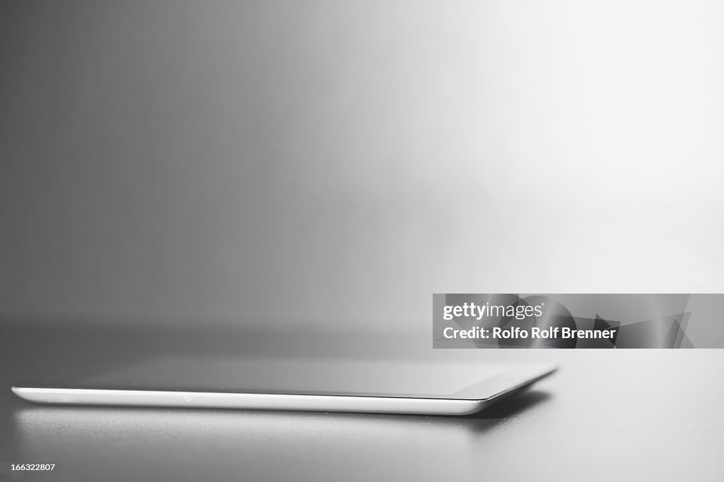 Digital tablet in dramatic lighting