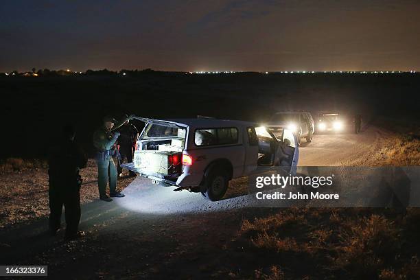 Border Patrol Agent inspects a pickup truckload of marijuana seized from drug smugglers near the U.S.-Mexico border on April 10, 2013 in Hidalgo,...