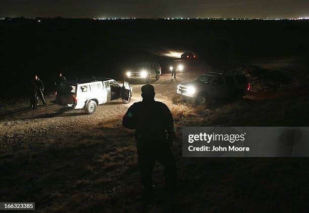 Border Patrol agents inspect a pickup load , of marijuana seized from drug smugglers near the U.S.-Mexico border on April 10, 2013 in Hidalgo, Texas....