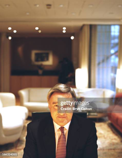 Sir Vernon Ellis, international chairman of Accenture Plc , poses for a photograph in his office following an interview at the company's headquarters...