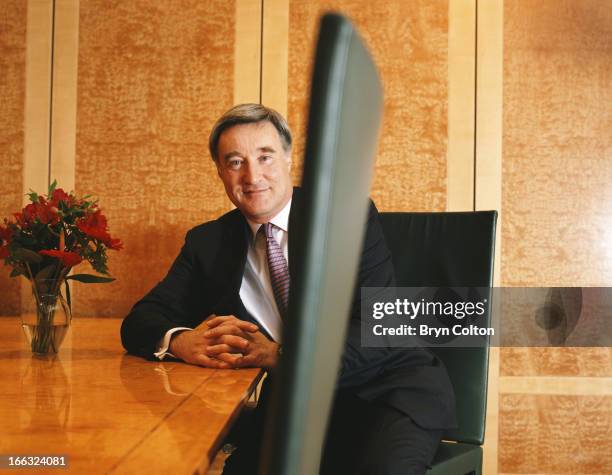 Sir Vernon Ellis, international chairman of Accenture Plc , sits in the boardroom and poses for a photograph at the company's headquarters in the...