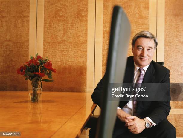 Sir Vernon Ellis, international chairman of Accenture Plc , sits in the boardroom and poses for a photograph at the company's headquarters in the...