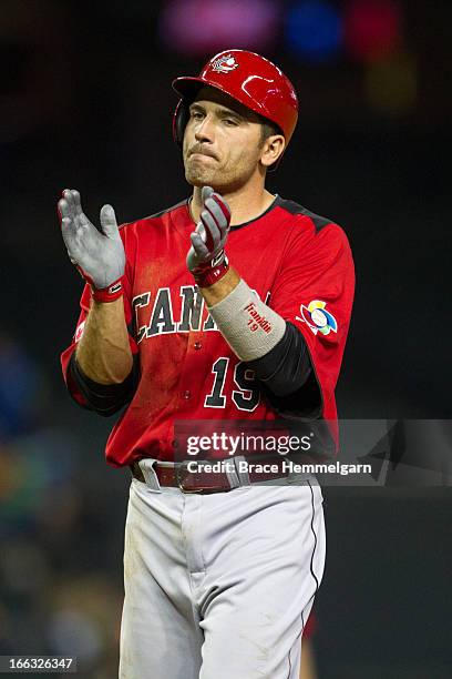 Joey Votto of Canada claps against Italy during the World Baseball Classic First Round Group D game on March 8, 2013 at Chase Field in Phoenix,...