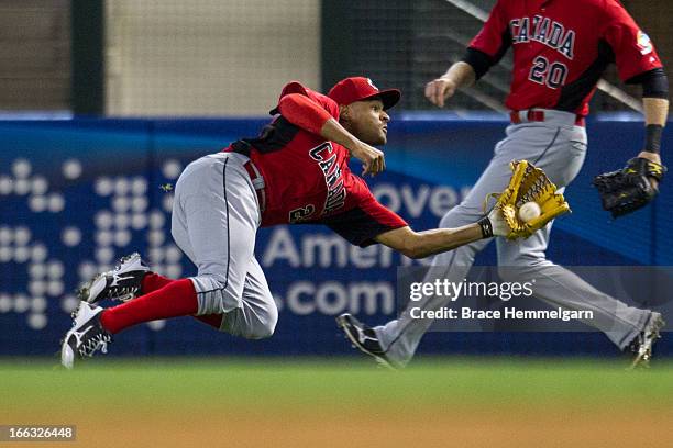 Tyson Gillies of Canada makes a diving catch against Italy during the World Baseball Classic First Round Group D game on March 8, 2013 at Chase Field...