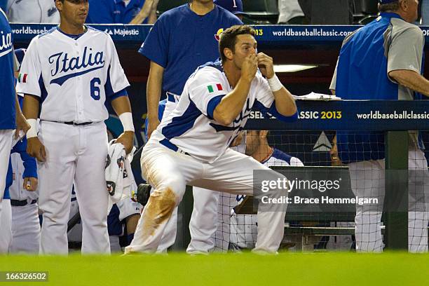 Chris Colabello of Italy celebrates a play against Canada during the World Baseball Classic First Round Group D game on March 8, 2013 at Chase Field...