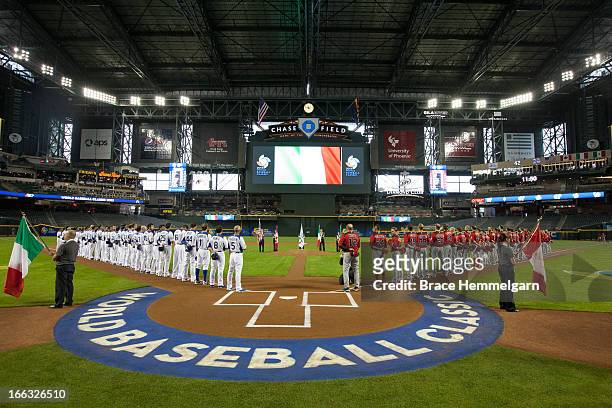 Italy and Canada stand during the national anthem during the World Baseball Classic First Round Group D game on March 8, 2013 at Chase Field in...