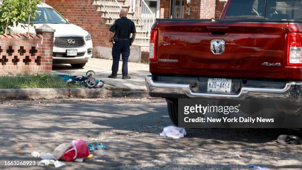 Officer guards the scene of an accident where a grandmother pushing her granddaughter was hit by Dodge Ram on the corner of Bath and 25th Aves. In...