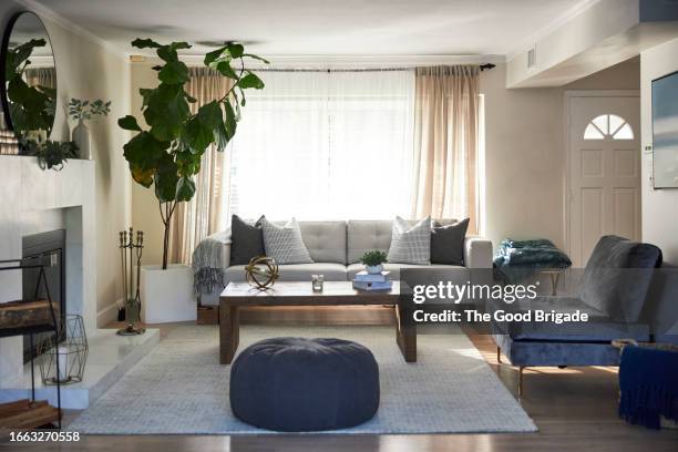 modern brightly lit living room - living room stock pictures, royalty-free photos & images