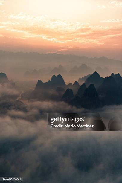 guilin hills landscape at sunrise - guangxi-zhuang-autonomous-region-china stock pictures, royalty-free photos & images