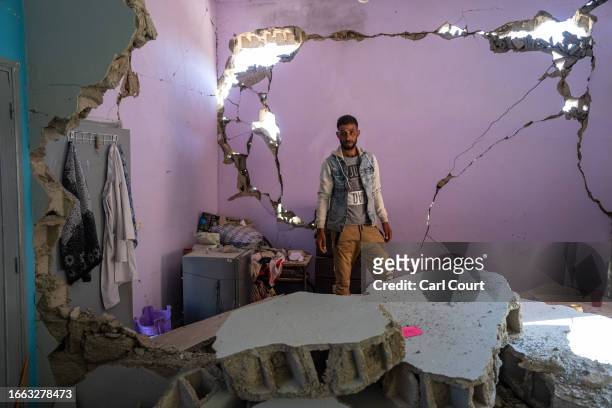 Man stands in the remains of a heavily damaged school following last Friday's earthquake, on September 13, 2023 in Ardouz, Morocco. A huge earthquake...