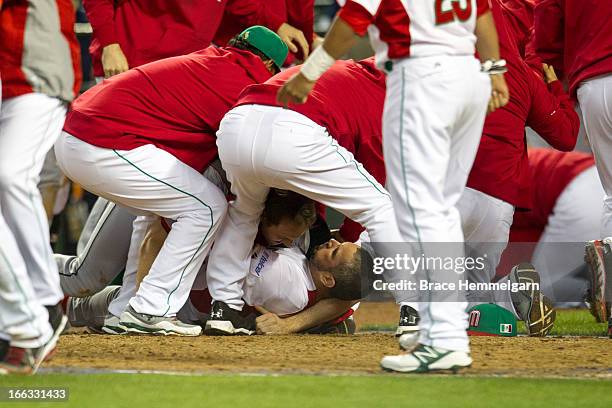 Bench clearing brawl occurs between Canada and Mexico during the World Baseball Classic First Round Group D game on March 9, 2013 at Chase Field in...