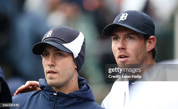 Doug Fister of the Detroit Tigers celebrates with teammate Rick Porcello in the dugout during the game against the Toronto Blue Jays at Comerica Park...