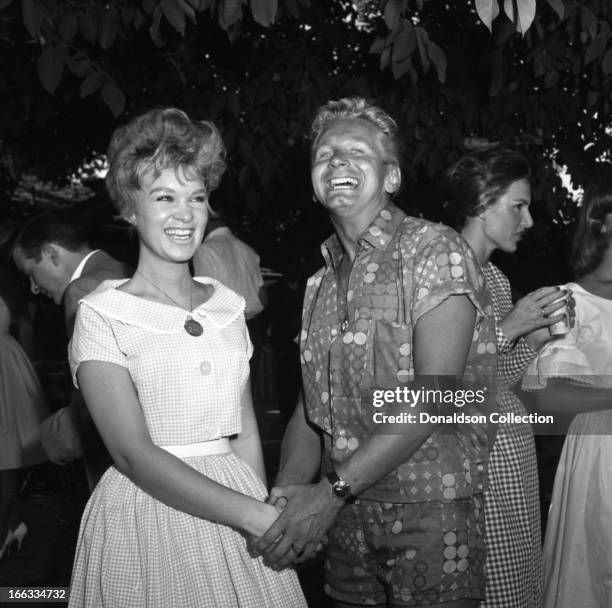 Actor Kenny Miller and friend at a pool party at Dick Clark's house in 1965 in Los Angeles, California .