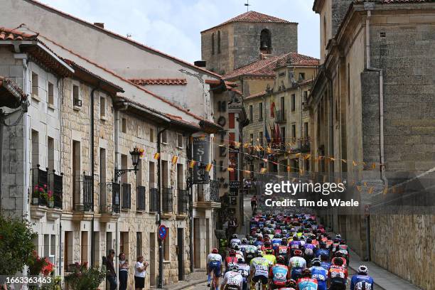 General view of the peloton passing through Santo Domingo de Silos Village during the 78th Tour of Spain 2023, Stage 11 a 163.2km stage from Lerma to...