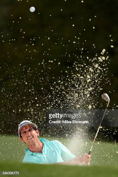 Gonzalo Fernandez-Castano of Spain hits out of a bunker on the 18th hole during the first round of the 2013 Masters Tournament at Augusta National...