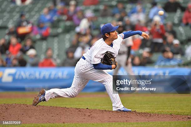 Relief pitcher Hisanori Takahashi of the Chicago Cubs delivers during the fifth inning against the San Francisco Giants at Wrigley Field on April 11,...