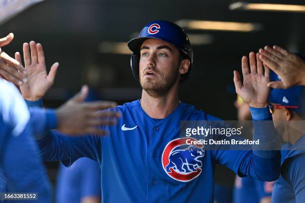Cody Bellinger of the Chicago Cubs celebrates after scoring a third-inning run against the Colorado Rockies at Coors Field on September 13, 2023 in...