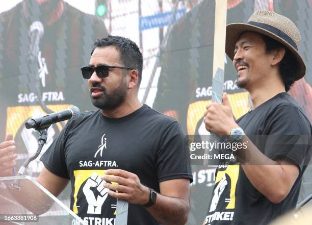 Kal Penn and John Cho are seen speaking at the SAG-AFTRA and WGA rally on September 13, 2023 in Los Angeles, California.