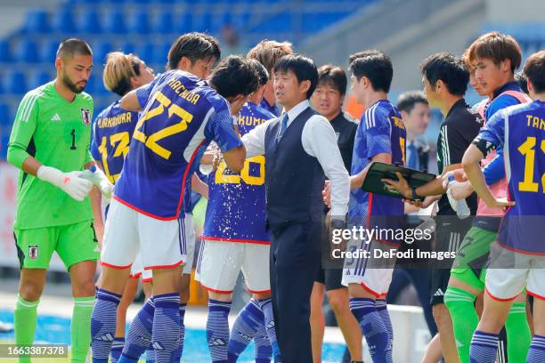 Koki Machida of Japan and head coach Hajime Moriyasu during the International Friendly match between Japan and Turkey at Cegeka Arena on September...