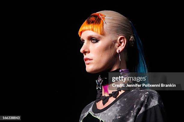 Model showcases designs on the runway at the Emma Mulholland show during Mercedes-Benz Fashion Week Australia Spring/Summer 2013/14 at Carriageworks...