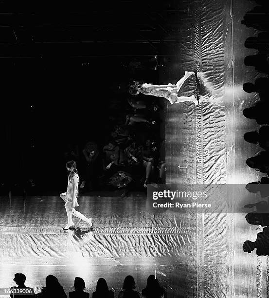 Models showcase designs on the runway at the Shakuhachi show during Mercedes-Benz Fashion Week Australia Spring/Summer 2013/14 at Carriageworks on...