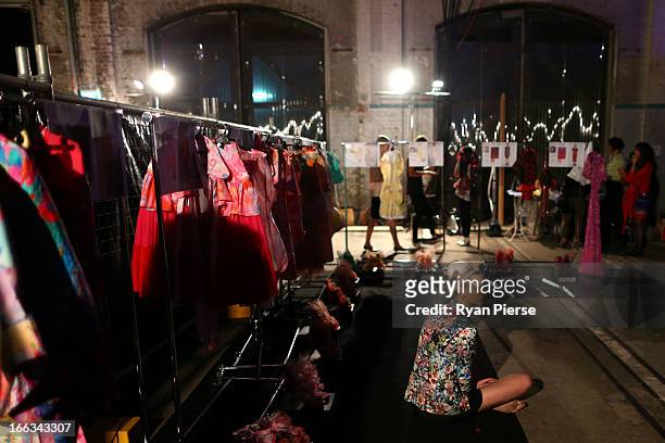 Models prepare backstage for the Romance Was Born show during Mercedes-Benz Fashion Week Australia Spring/Summer 2013/14 at Carriageworks on April 8,...
