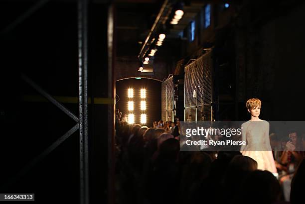 Model showcases designs on the runway at the Alex Perry show during Mercedes-Benz Fashion Week Australia Spring/Summer 2013/14 at Carriageworks on...