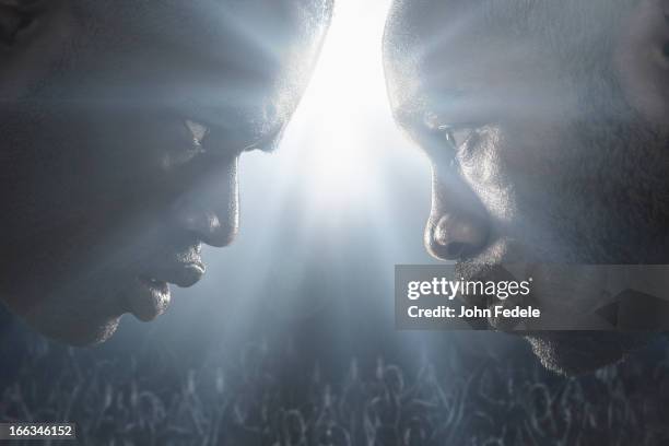 african american boxers standing face to face - aanvallen sporten stockfoto's en -beelden