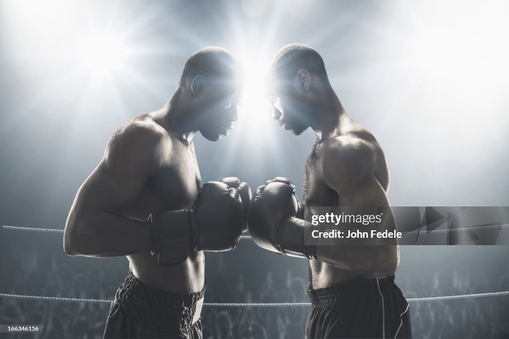 Umělecká fotografie African American boxers standing in boxing ring