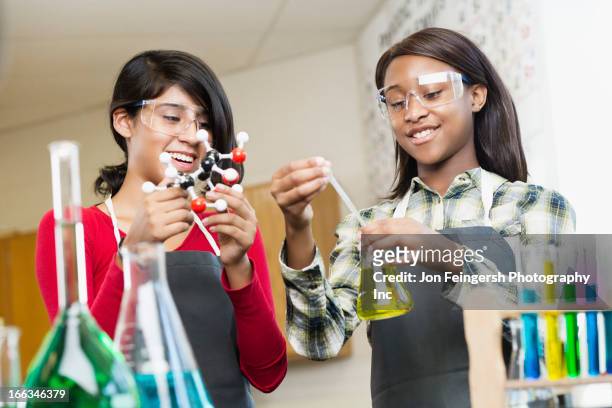 students working with chemicals in classroom - preteen girl models stock pictures, royalty-free photos & images