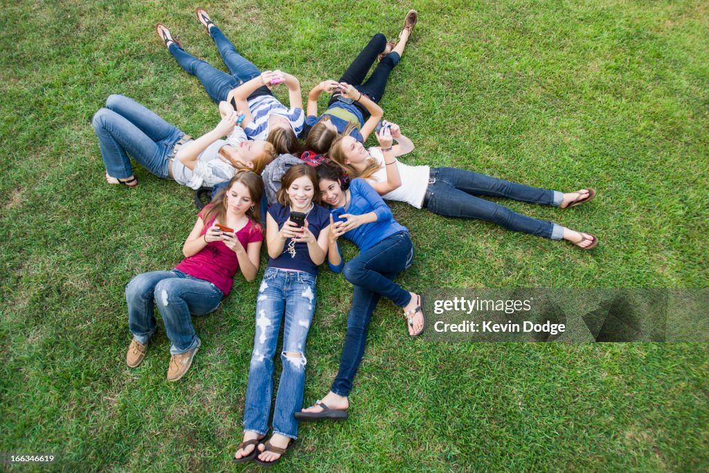 Friends hanging out together on grass