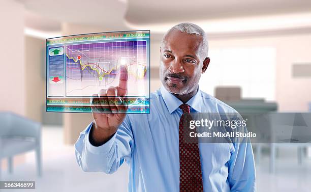 black businessman using digital display - financial advisor virtual stock pictures, royalty-free photos & images