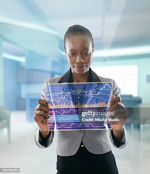 african american businesswoman using digital display - financial advisor virtual stock pictures, royalty-free photos & images