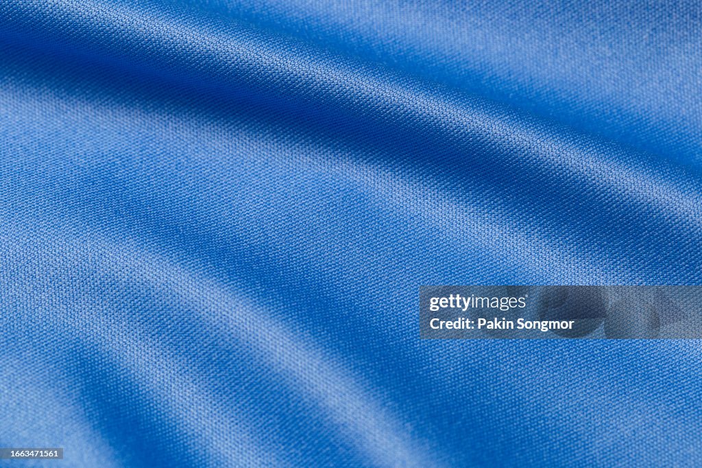 Blue color sports clothing fabric football shirt jersey texture and textile background