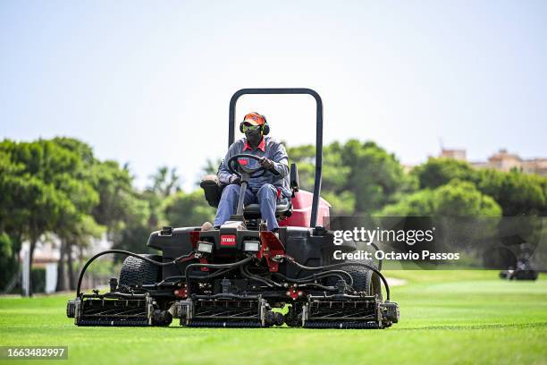 Green keeper uses a mower to help prepare the course prior to the Challenge de Espana at Club de Golf Playa Serena on September 6, 2023 in Almeria,...