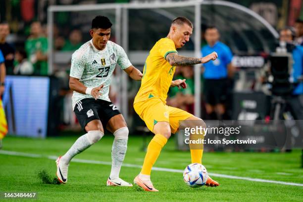 Australia forward Mitchell Duke controls the ball while Mexico defender Jesús Gallardo defends during an international friendly between Australia and...
