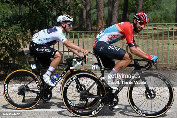 Remco Evenepoel of Belgium and Team Soudal - Quick Step - White Best Young Rider Jersey jokes with Thomas De Gendt of Belgium and Team Lotto Dstny...