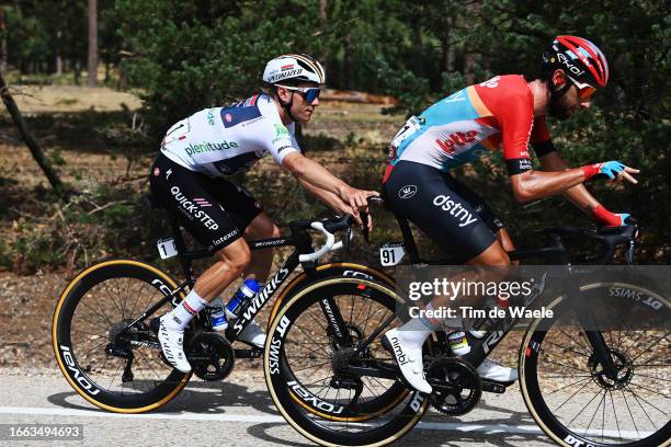 Remco Evenepoel of Belgium and Team Soudal - Quick Step - White Best Young Rider Jersey jokes with Thomas De Gendt of Belgium and Team Lotto Dstny...