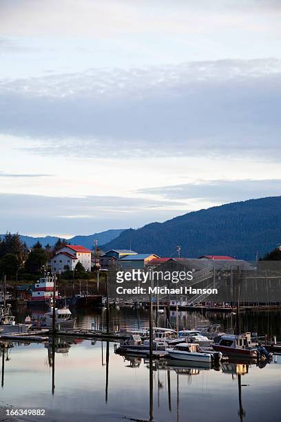 a marina at dusk near in the town of wrangell, alaska. - anchored stock pictures, royalty-free photos & images
