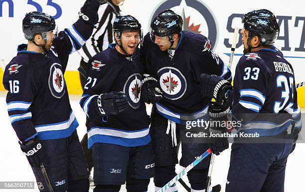 Andrew Ladd, Aaron Gagnon, Blake Wheeler, Mark Stuart and Dustin Byfuglien of the Winnipeg Jets celebrate a first period goal against the Florida...