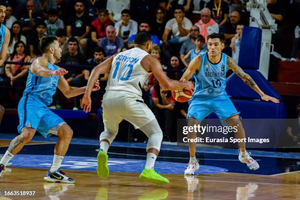 Eric Gordon of Bahamas is challenged by Carlos Delfino of Argentina during FIBA Olympic Pre-Qualifying Tournament Final match between Bahamas and...