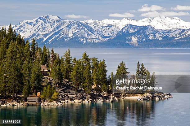 the famous property of the thunderbird lodge is framed by lake tahoe and the snow-capped peaks of the sierra nevada, nv. - nevada stockfoto's en -beelden