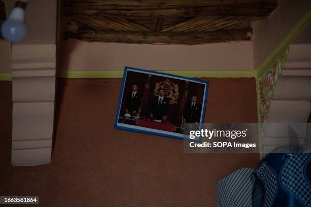 Photo of Morocco King Mohammed VI is seen hanging tilted on the wall. Villagers living in Imlil in the Toubkal mountains, are still coming to terms...