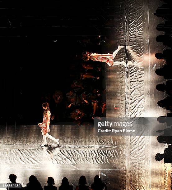 Multiple exposures were combined in camera to produce this image. Models showcase designs on the runway at the Shakuhachi show during Mercedes-Benz...