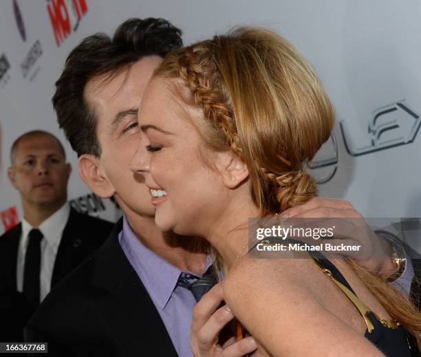 Actors Charlie Sheen and Lindsay Lohan arrive for the premiere of Dimension Films' "Scary Movie 5" at ArcLight Cinemas Cinerama Dome on April 11,...