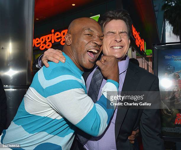 Actors Mike Tyson and Charlie Sheen arrive at the premiere of "Scary Movie V" presented by Dimension Films, in partnership with Lexus and Chambord at...