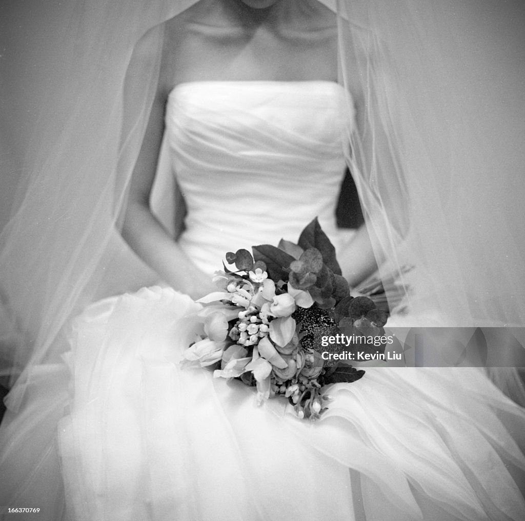 Woman in wedding gown holding a bouquet