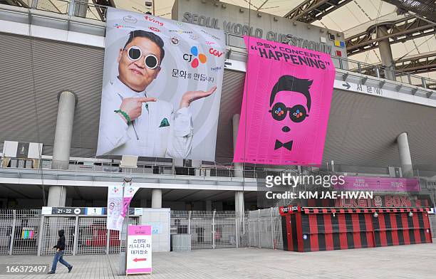 Banners advertising a concert by South Korean rapper Psy are displayed outside the World Cup Stadium in Seoul on April 12 a day before the "Gangnam...
