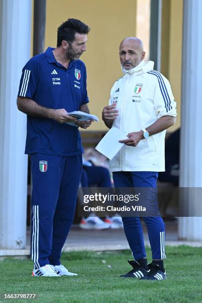 Head coach of Italy Luciano Spalletti and Italy Head of Delegation Gianluigi Buffon chat during Italy training session at Centro Tecnico Federale di...